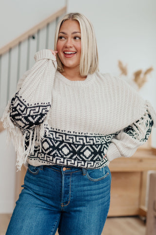 Classic Knit Versatility: Women's Knit Sweater. This versatile knitted sweater is a timeless wardrobe essential, perfect for layering or wearing on its own. 