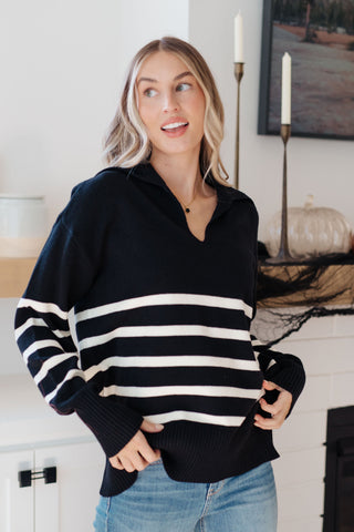 Striped Style: Women's Striped Sweater. Add a touch of timeless pattern to your outfit with this women's striped sweater.