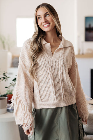 Fringe Fun: Women's Fringe Sweater. Add a touch of bohemian flair to your outfit with this stylish women's fringe sweater. 