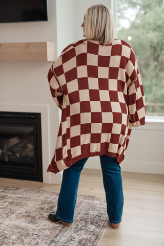 Dress Up or Down: Women's Checkered Cardigan. This stylish checkered cardigan can be dressed up or down for a variety of occasions.